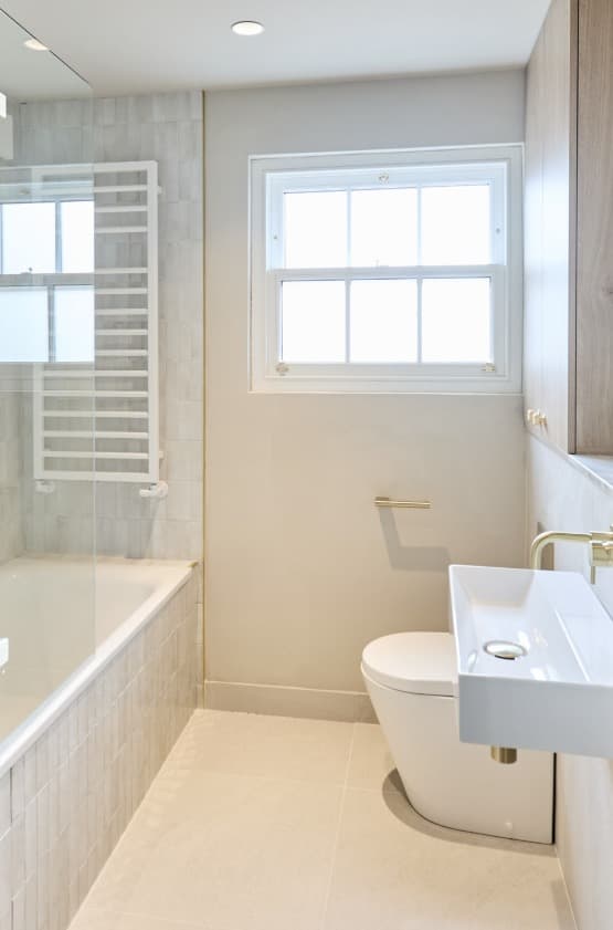 Light tiled family bathroom completed by 1st Boiler Care